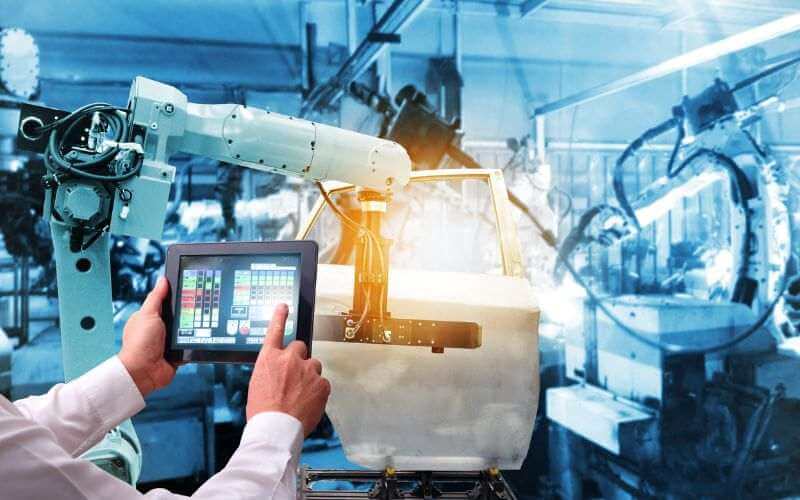 The man's hand is using a tablet for his work